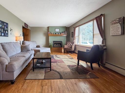 Spacious living room with fireplace and natural light