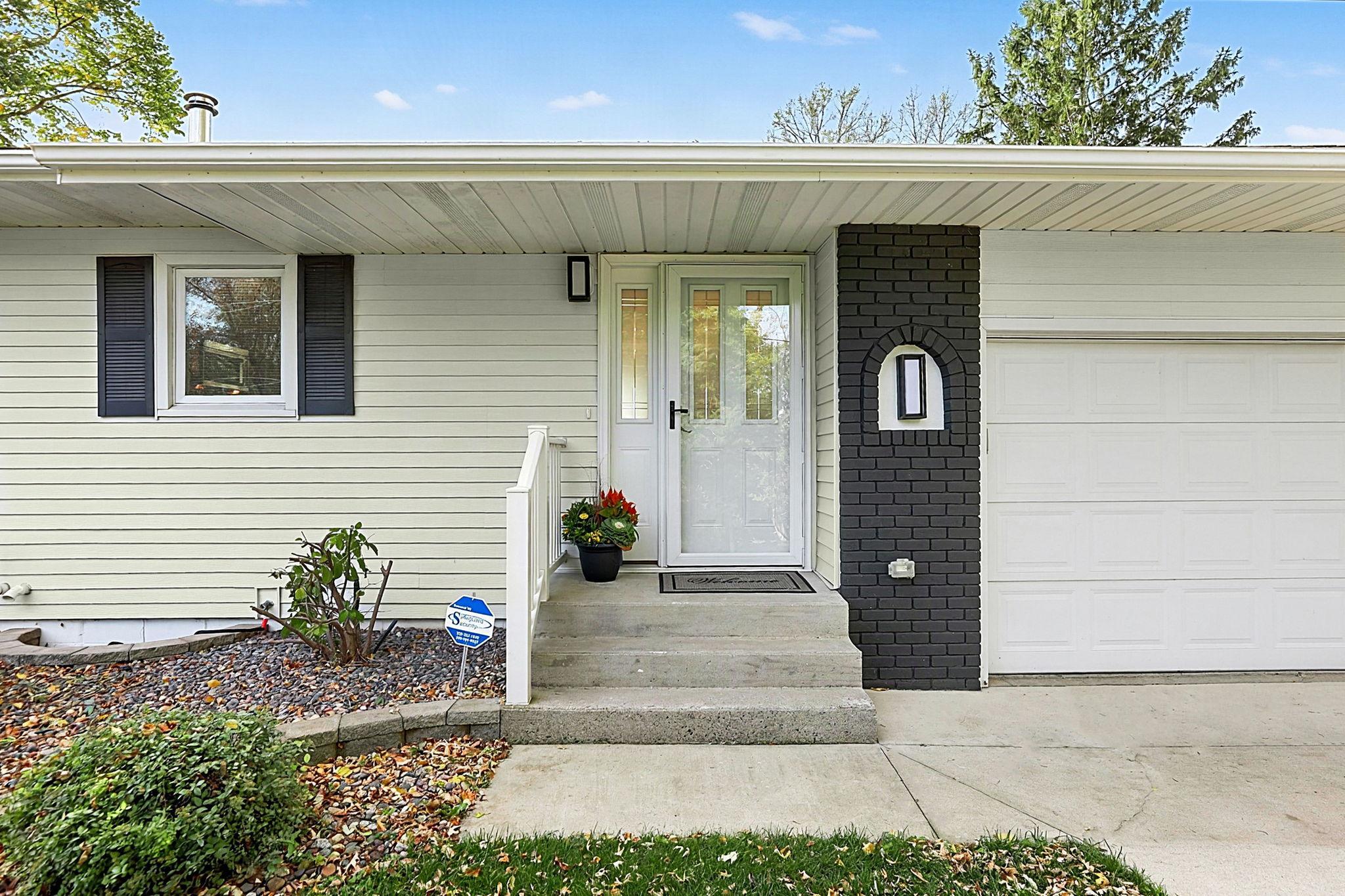 Welcome entrance with minial steps - attached oversized 2 stall garage w/side garage door too