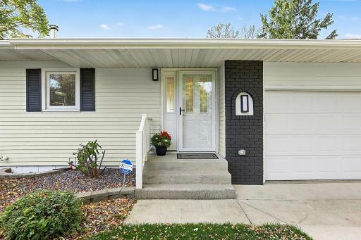 Welcome entrance with minial steps - attached oversized 2 stall garage w/side garage door too