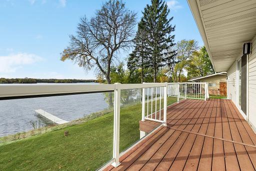 Glass railing offers completely unobstructed views for Great Northern Lake. Maintenance free 30ft long deck