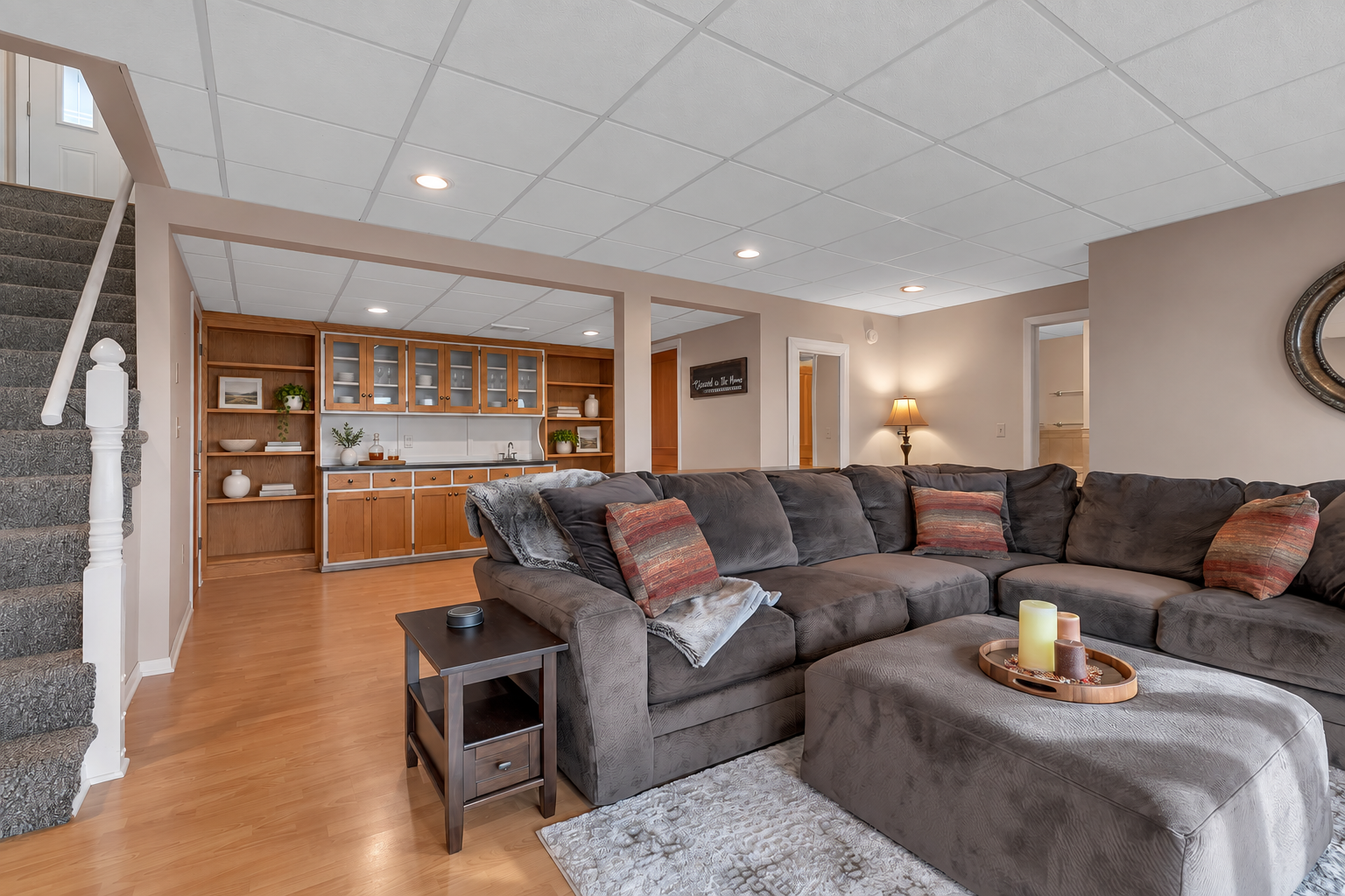 The lower level wet bar is an added bonus while entertaining friends and family (virtually decorated wet bar)