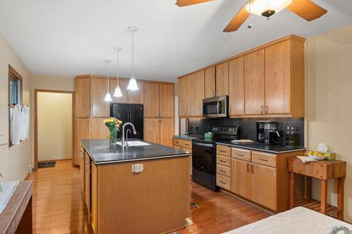 A full wall of cabinetry adds both style and storage, creating a standout feature in the kitchen.