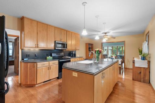 The kitchen is complete with stainless steel appliances and plenty of cabinet storage, creating a functional and inviting space for everyday living.
