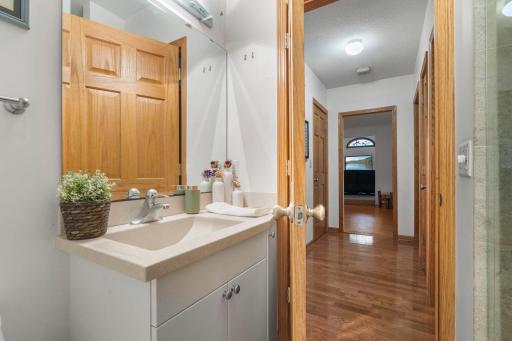 Main-floor 3/4 bathroom conveniently serving the main living areas and second bedroom.