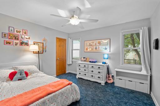 The second bedroom is located on the main level, overlooking the side yard and featuring two spacious closets.