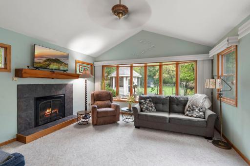Bright and open family room located off of the dining room complete with a large bay window overlooking the back yard, patio access and 11' vaulted ceilings.