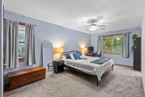 Primary suite located off of the main living area with a walk in closet and private ensuite.