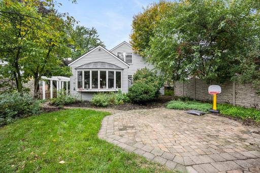 Spacious paver patio in the backyard complte with access to side patio and front of the home.