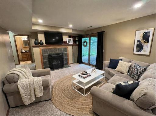 Lower level family room with gas fireplace that walks-out to backyard.