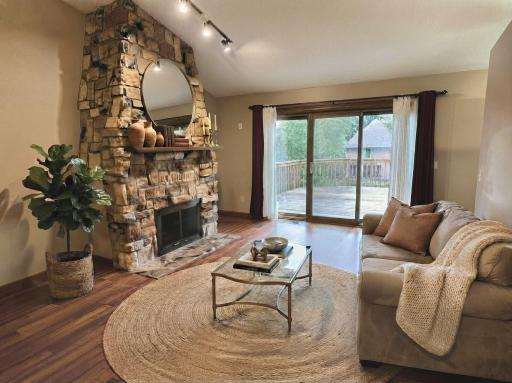 Main floor vaulted living room that leads to newly remodeled deck.