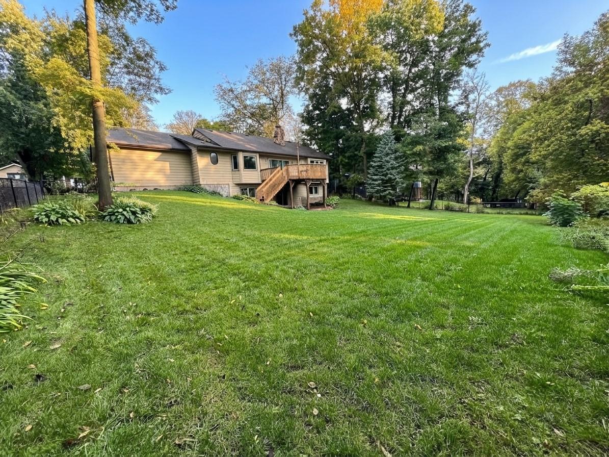 Absolutely beautiful backyard that had many trees removed and fence added.