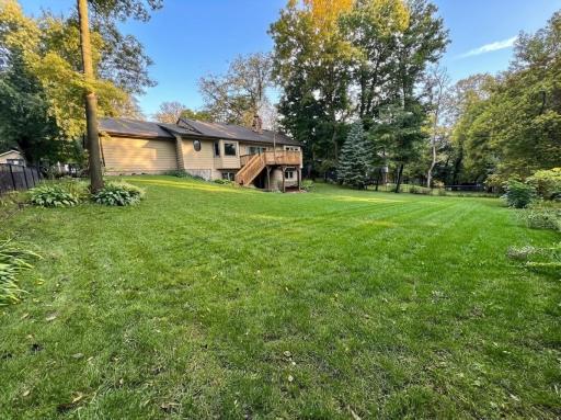 Absolutely beautiful backyard that had many trees removed and fence added.