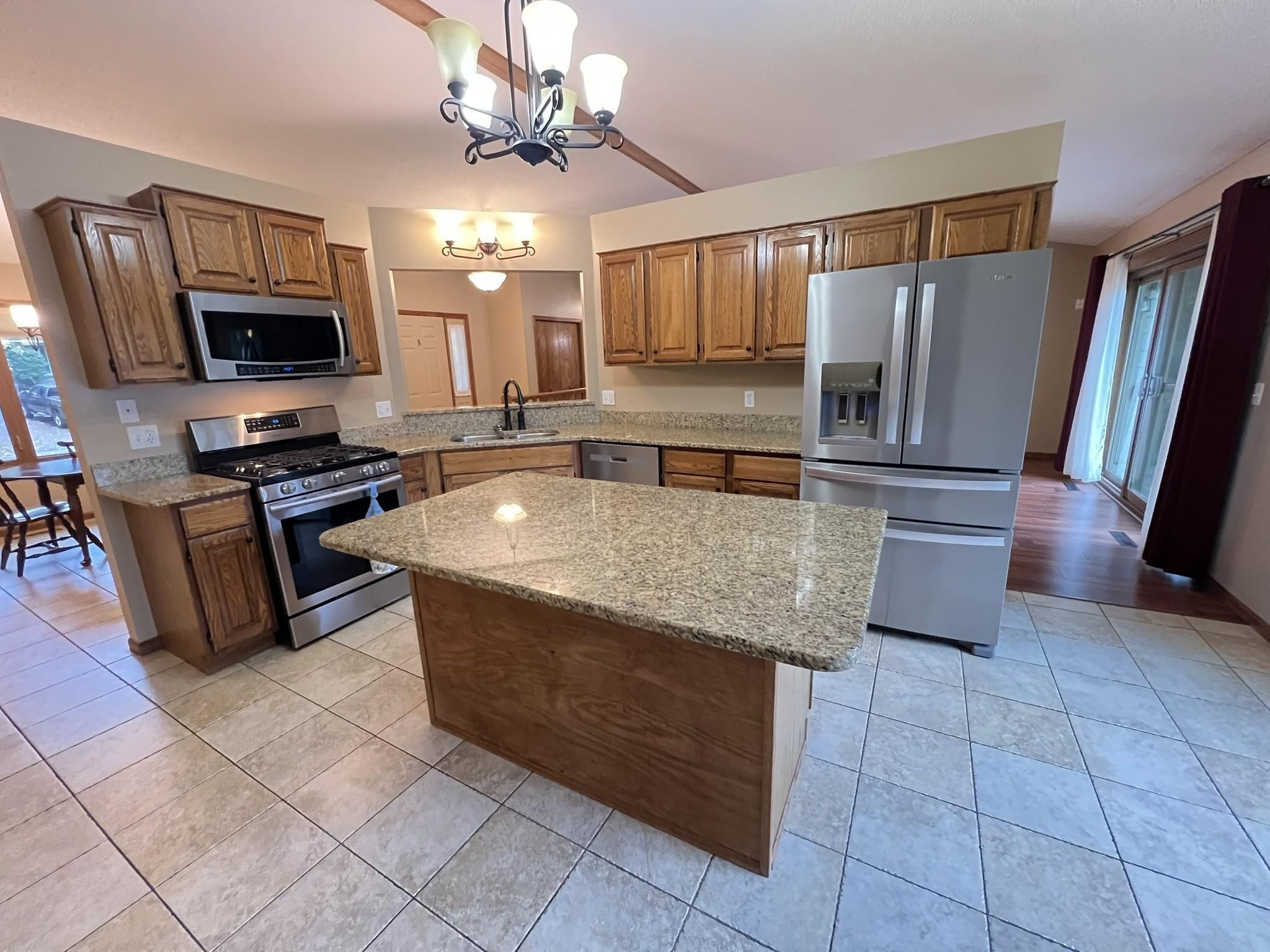 Spacious kitchen with granite counter tops.