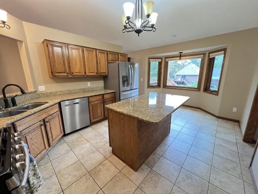Ceramic tile flooring with bayed informal dining area.