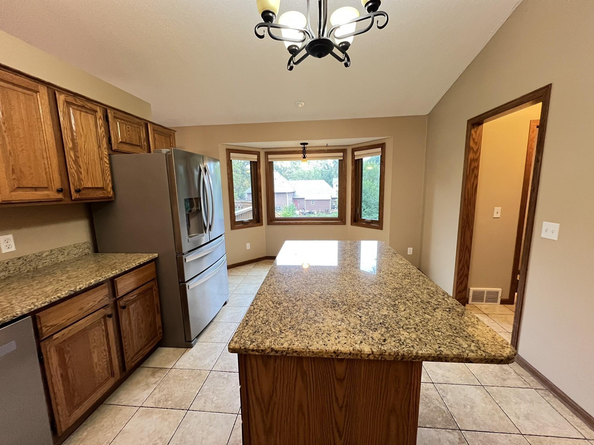 Kitchen also has newer stainless steel appliances.