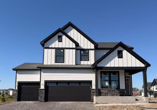 High-quality modern materials, including vinyl siding, stone accents, and contrasting trims combine to create a sophisticated and durable exterior
