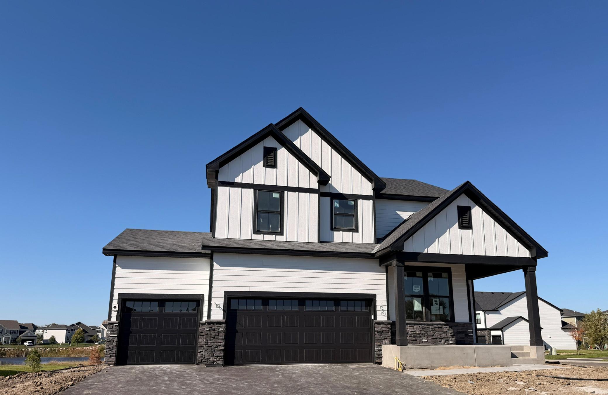 Striking curb appeal with clean lines and modern architectural design. The well-manicured landscaping complements the sleek exterior finishes, creating a welcoming and polished first impression.