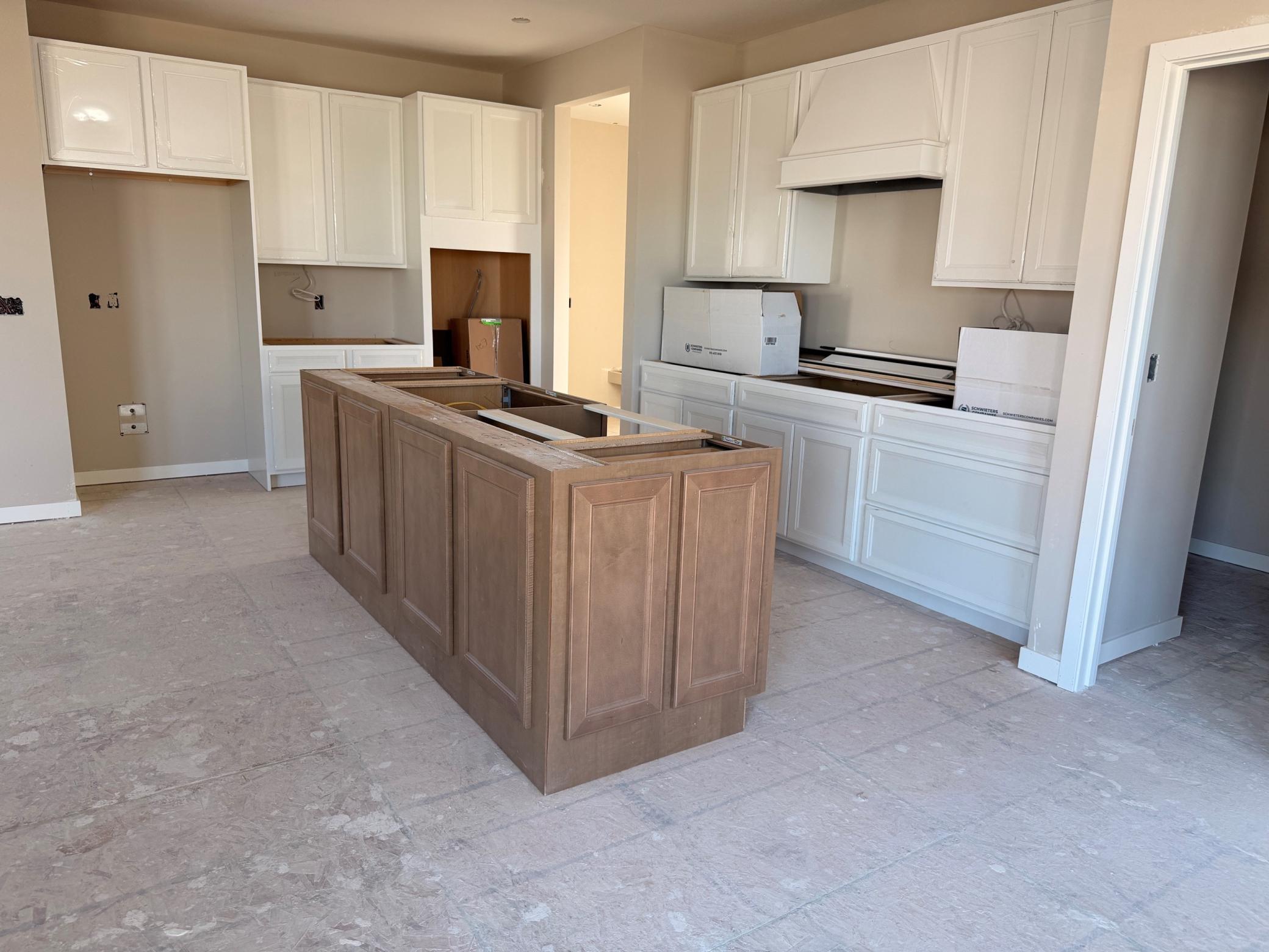 Bright and spacious kitchen featuring ample cabinetry, sleek countertops, and a functional layout—perfect for everyday living and entertaining.
