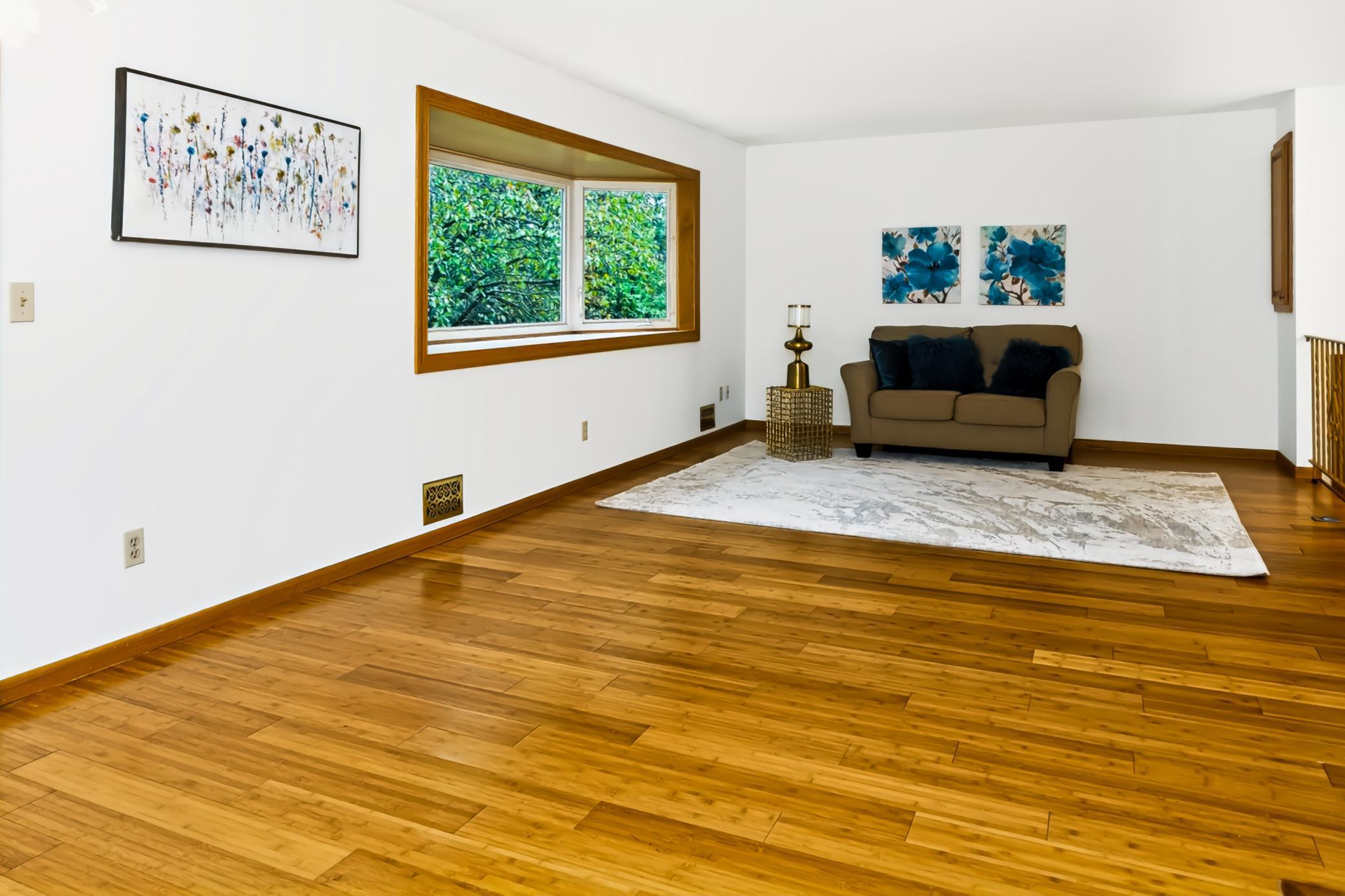 Bright living with newer hardwood floors.