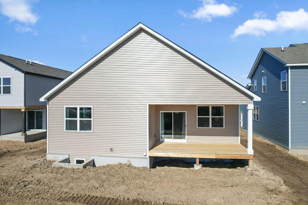 This is a previously built home. 1712 Oak Creek Drive will be similar with a covered deck and lower level egress window.