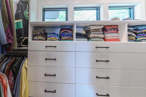Primary Closet Features Plenty of Built Ins