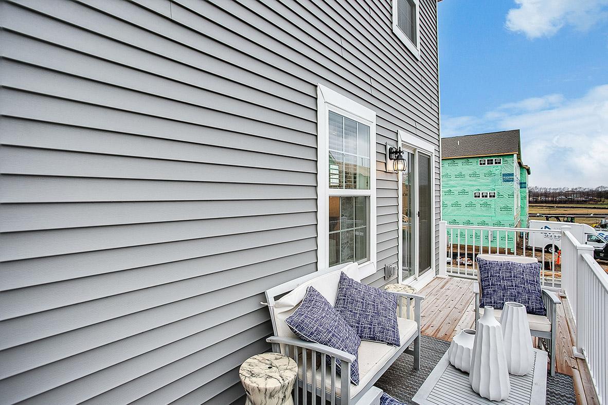 This GIANT deck allows room for everyone...to grill AND chill! *Model home, colors and selections will vary.