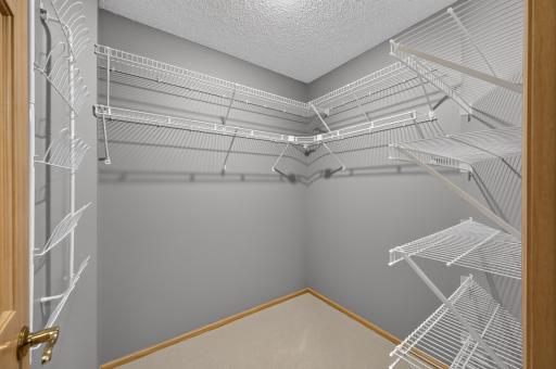 Large walk-in primary closet.