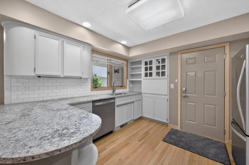 The remodeled kitchen is the heartbeat of the home and the gathering space for all.