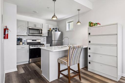 Open kitchen with granite and stainless appliances