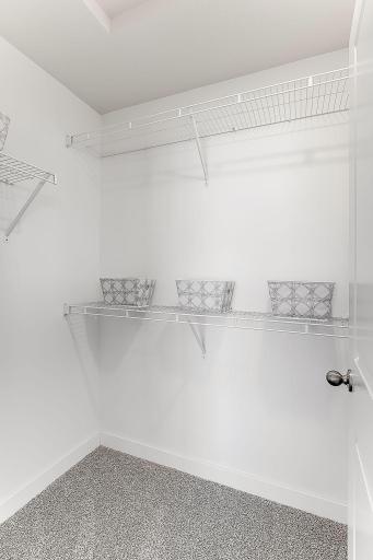 Primary walk-in closet. *Model home, colors and selections will vary.