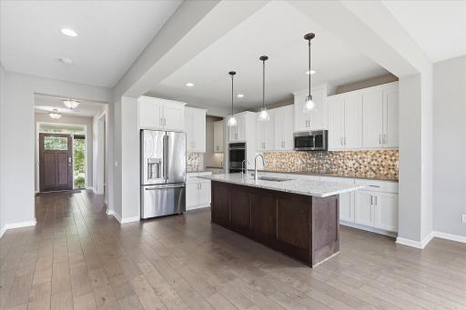 Wow....gourmet kitchen with high end appliances including a double oven, cooktop and microwave