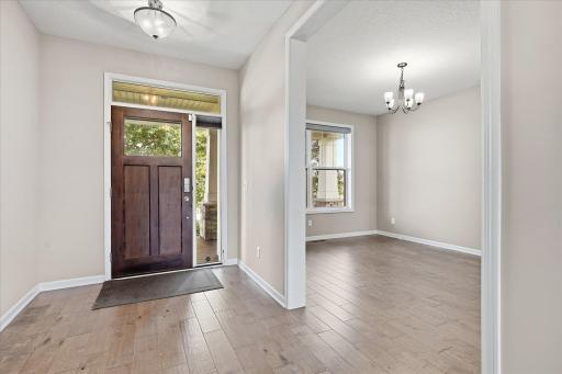 Large front entry foyer with a formal dining room that is conveniently located just off the kitchen with a butlers service counter between