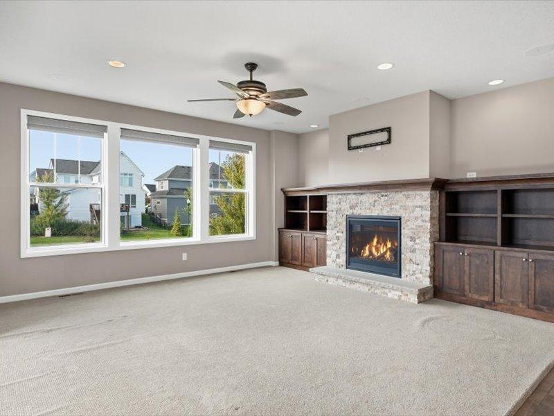 Another view of family room showing large windows. The blinds on these windows along with the informal dining windows are controlled by a handy remote