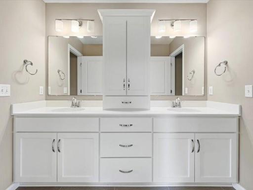 Large vanity with two separated sinks and lots of storage in the jack and jill bath