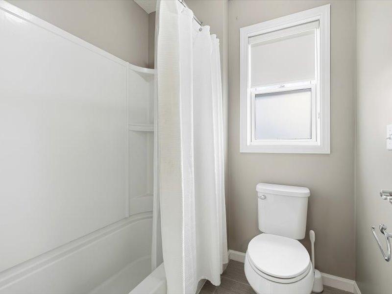 Separated tub/shower and stool area off the jack and jill bath