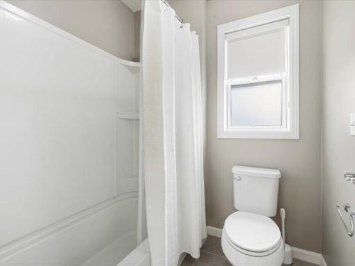 Separated tub/shower and stool area off the jack and jill bath