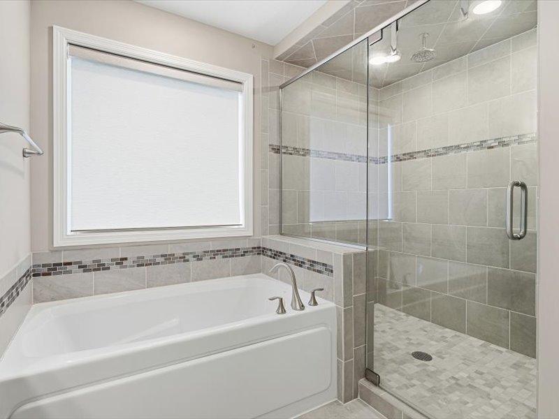 Primary bath also has soaking tub and large walk in shower