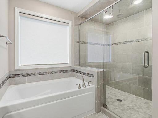 Primary bath also has soaking tub and large walk in shower