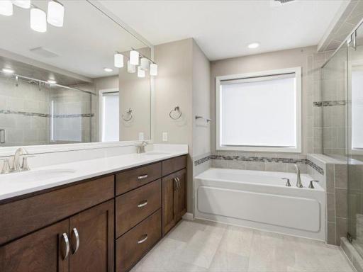 Primary bath features a very large vanity with built ins and double sinks