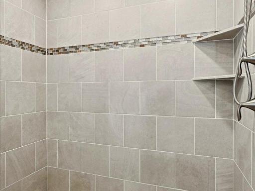 Beautiful tile work thruout the primary bath