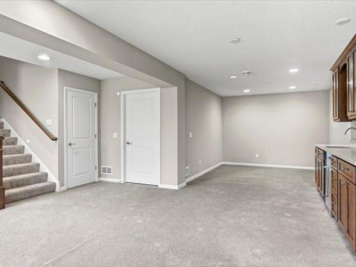 Lower level is all finished. Also note that the utility room has the furnace and mechanicals, plus an extra storage room to the back of this area. also, lights are on a motion detector....step in 2 steps and the lights go on