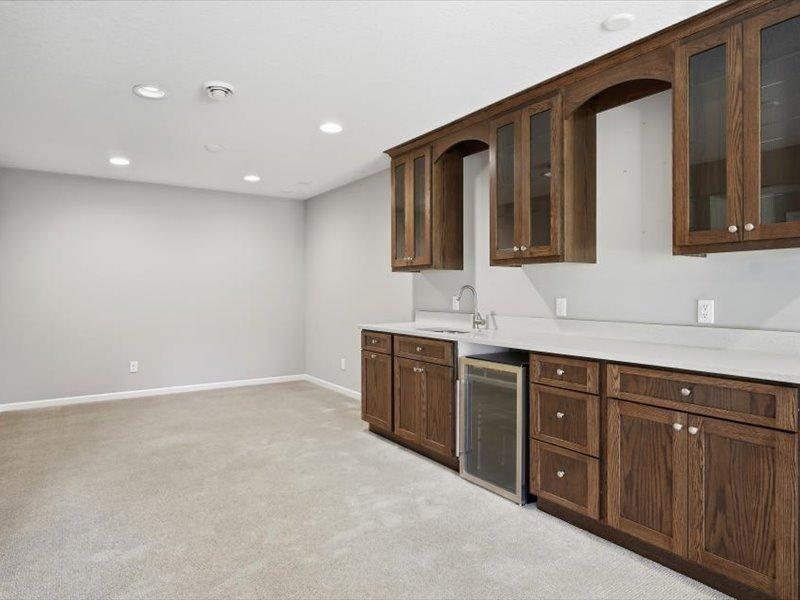 this shows an area off the wet bar that former owner used for exercise area