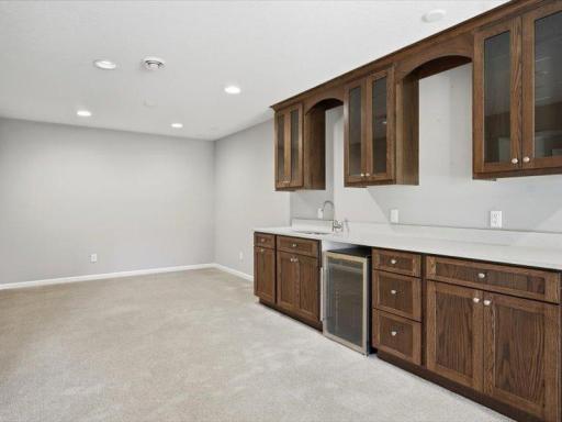 this shows an area off the wet bar that former owner used for exercise area