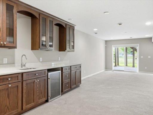 View across the wet bar to the walkout back of the home