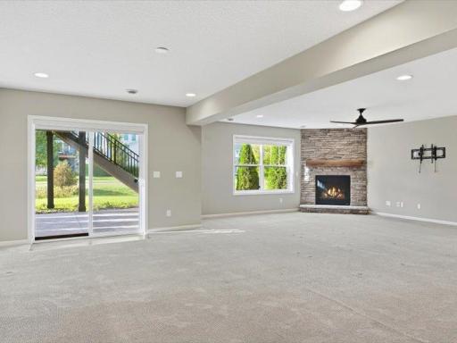 Showing the walkout to the very large patio, plus view across lower level family room