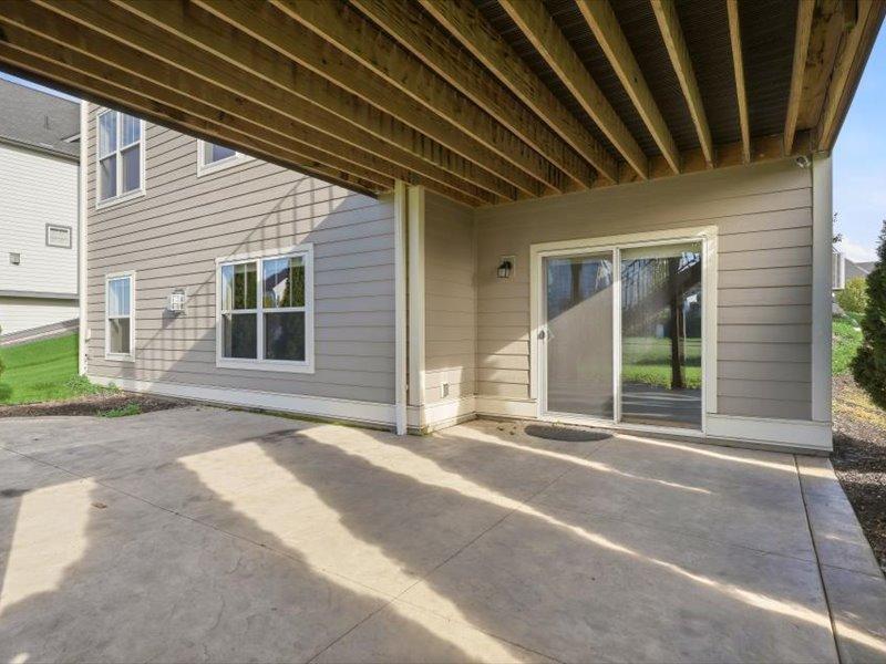 Huge patio off the lower level, with nice privacy