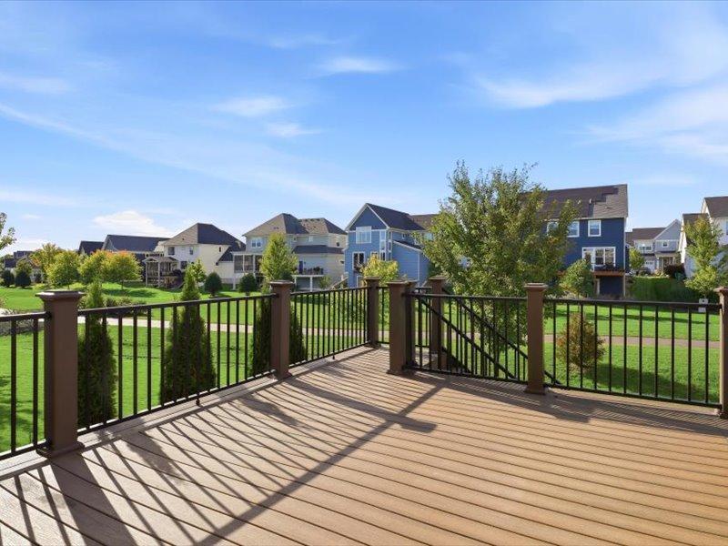 The large deck off the main level overlooks common areas and walking path