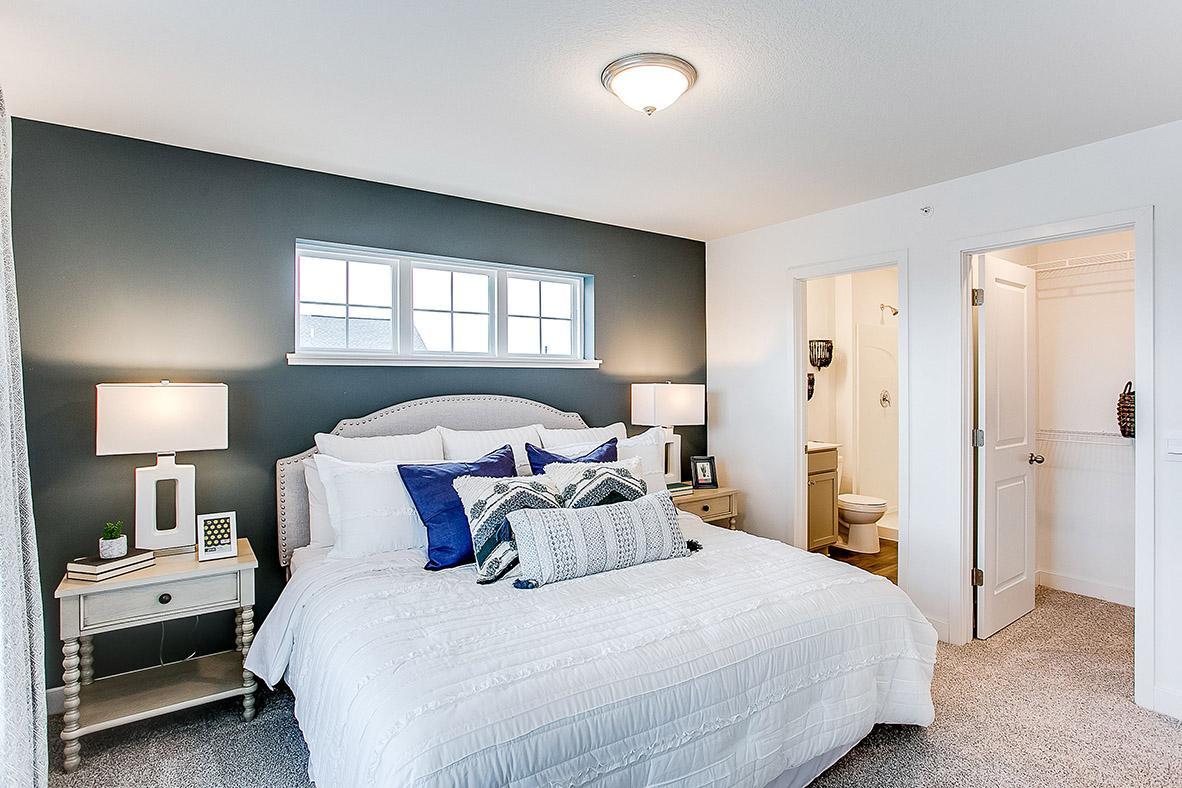 Walk-in closet and bathroom for extra convenience! *Model home, colors and selections will vary.