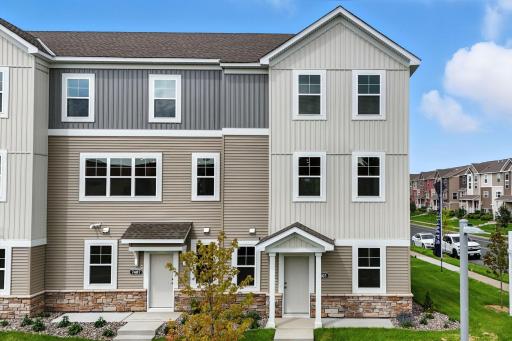 Exterior Image of the Capri End Unit Townhome. Photo of previous model home, options and color selections may vary.