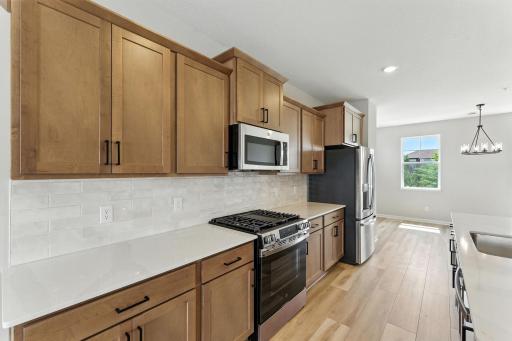 Open Kitchen for family gatherings, parties and creating great memories. Photo of previous model home, options and color selections may vary.